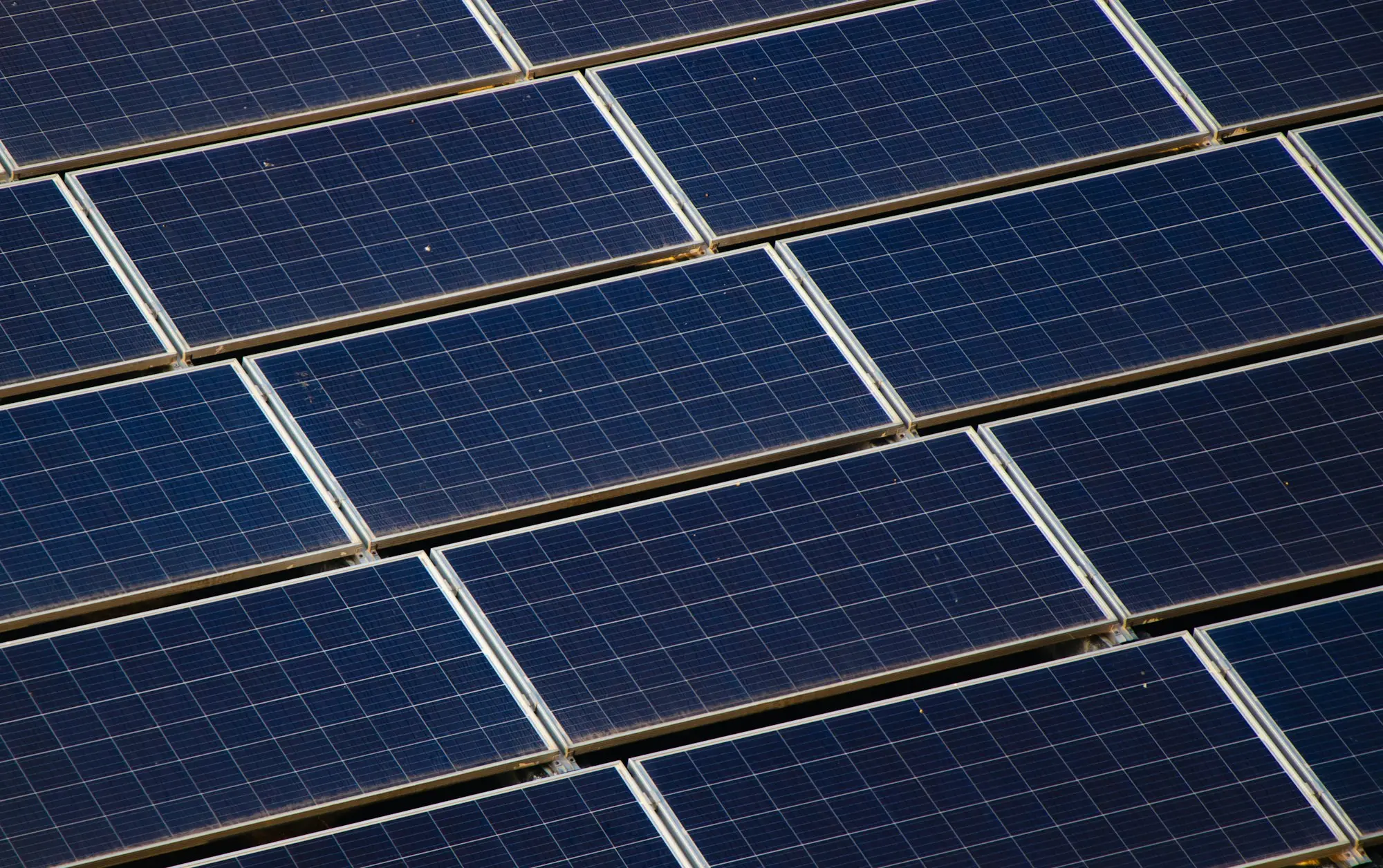 Rows of solar panels on a commercial roof, the kind of system a business times around the 1 January rebate step-down